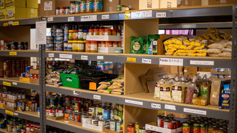 shelves filled with food and other items in a food pantry